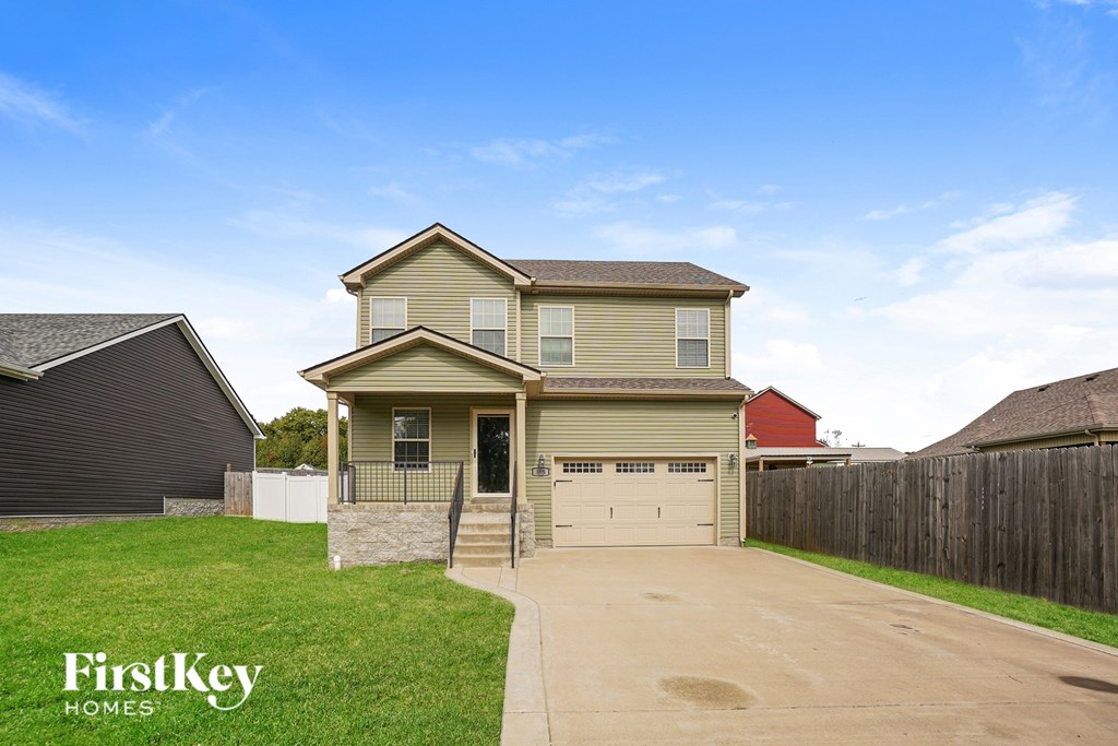 A house with a garage is for sale by FirstKey Homes.