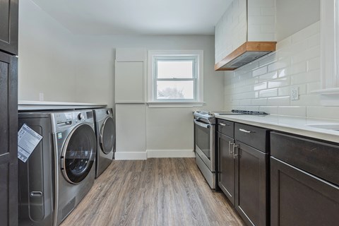 A laundry room with a washer and dryer.