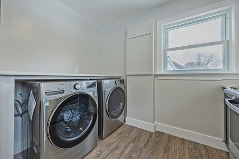 A laundry room with a washer and dryer.