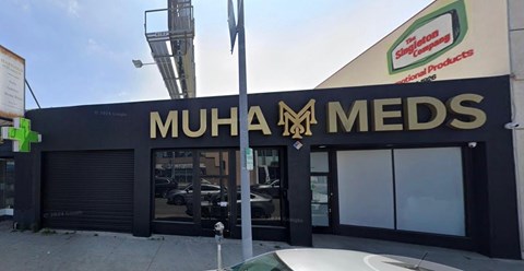 A storefront with a sign that reads "Muhammed Meds".