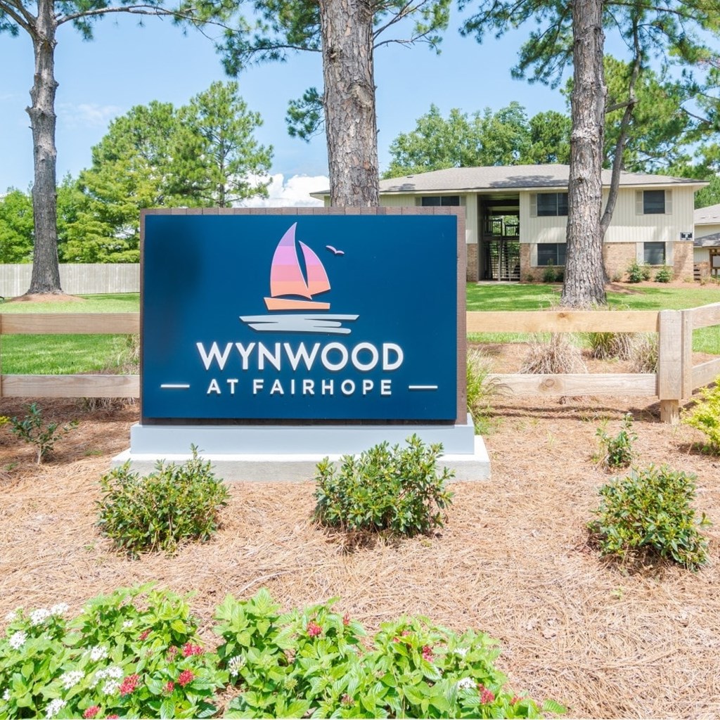A sign that says "Wynwood at Fairhope" is in front of a building.