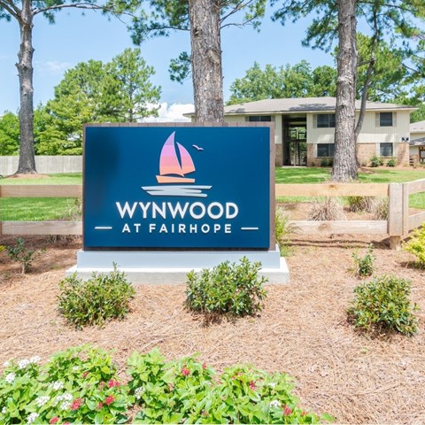 A sign that says "Wynwood at Fairhope" is in front of a building.