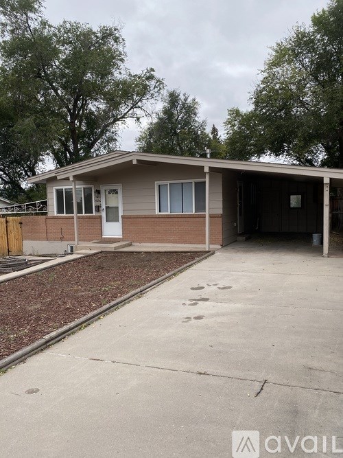 A house with a garage is for sale.