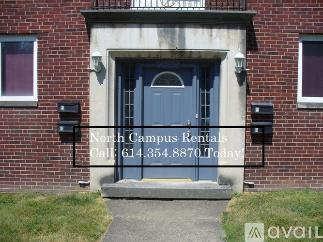 A grey door with a window on the wall.
