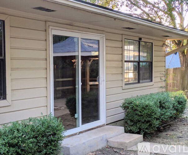 A house with a white door and a glass window.