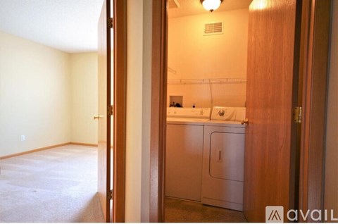A kitchen area with a sink and a dishwasher.