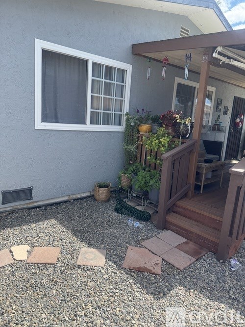 A small patio with a table and chairs.