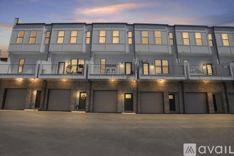 A large building with multiple garage doors is available for rent.