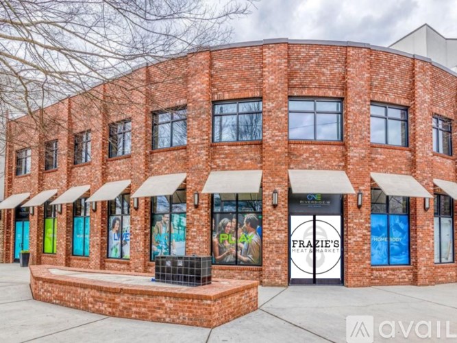 A brick building with a sign that says Frazie's Heat Market.