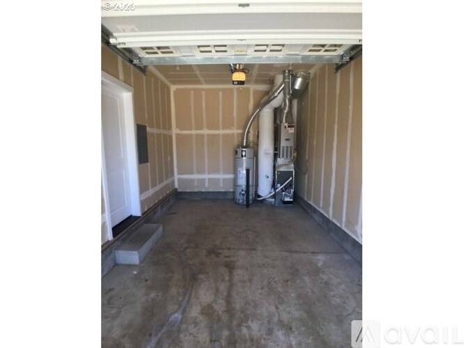 A room with a white ceiling and a concrete floor.