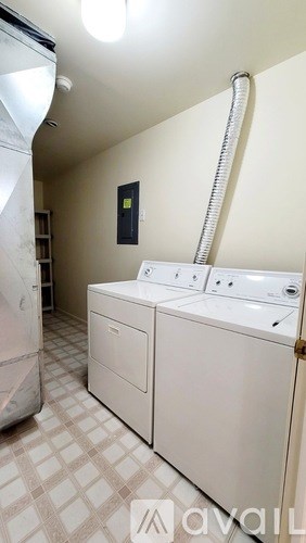 A laundry room with a washer and dryer.