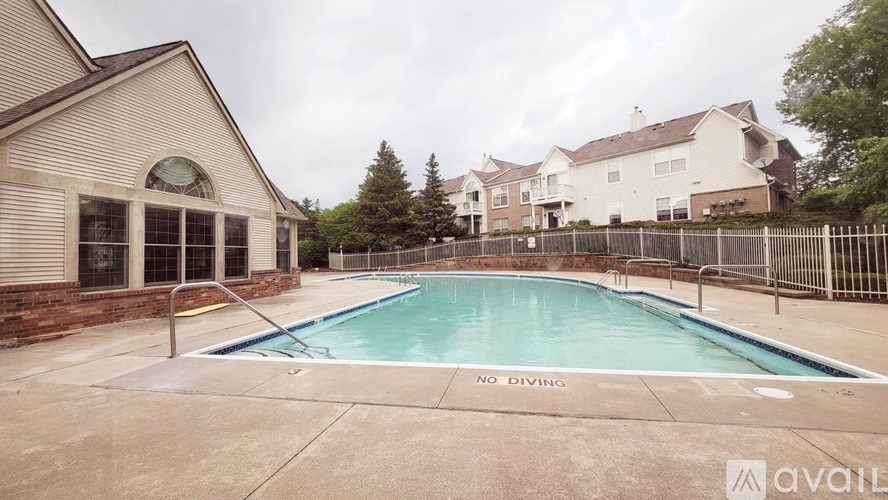 A pool with a "No Diving" sign in the middle of it.