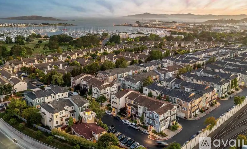 A bird's eye view of a residential area with houses and streets.