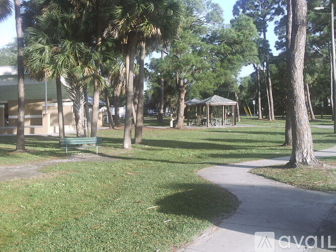 A park with a gazebo and trees.