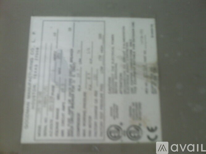 A white paper with text and symbols is displayed on a grey background.