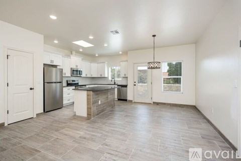A kitchen with a large island in the middle of the room.