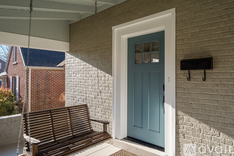 A blue door is on the right side of a white door.