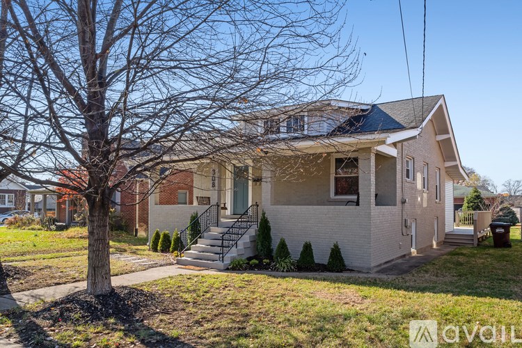 A house with a tree in front of it.