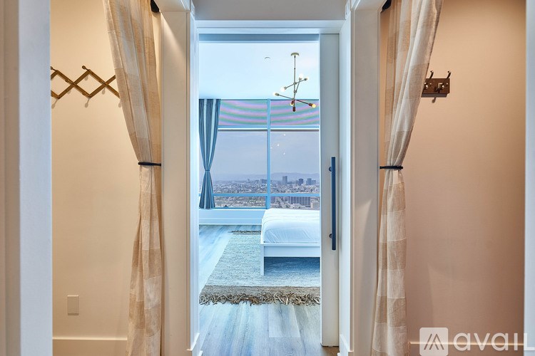 A room with a view of a snowy landscape through a sliding glass door.