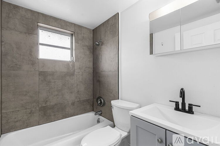A bathroom with a white toilet and sink.