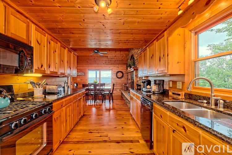 A kitchen with wooden cabinets and a stove top oven.