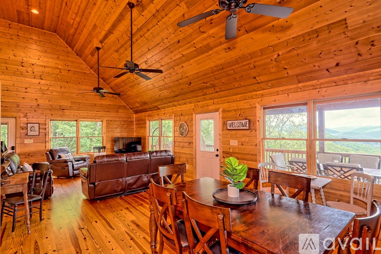 A living room with wooden floors and furniture.