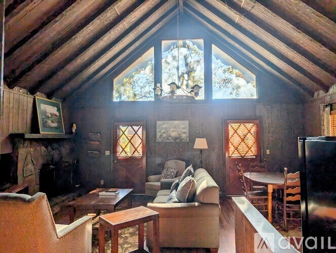 A living room with a fireplace and a couch.