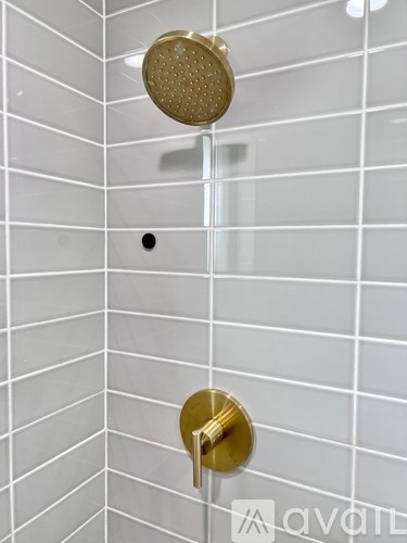 A shower head mounted on a wall.
