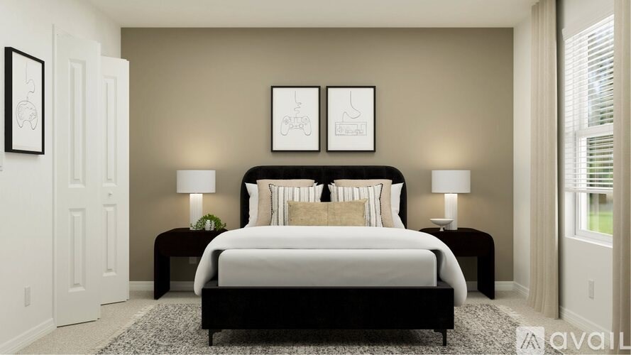 A bedroom with a large bed, two lamps, and two pictures on the wall.