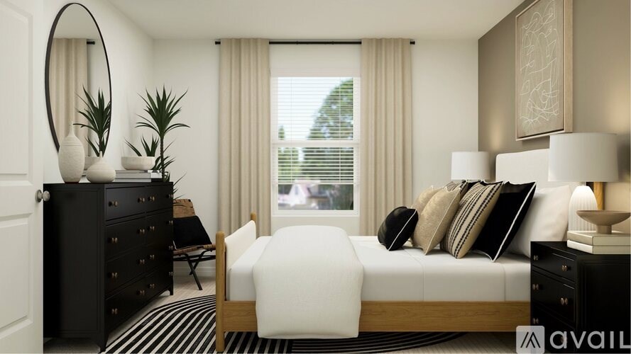 A modern bedroom with a large bed, a black dresser, and a large window with curtains.