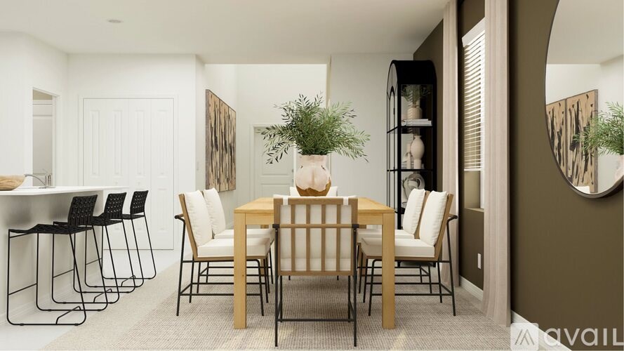 A dining room with a table set for six.