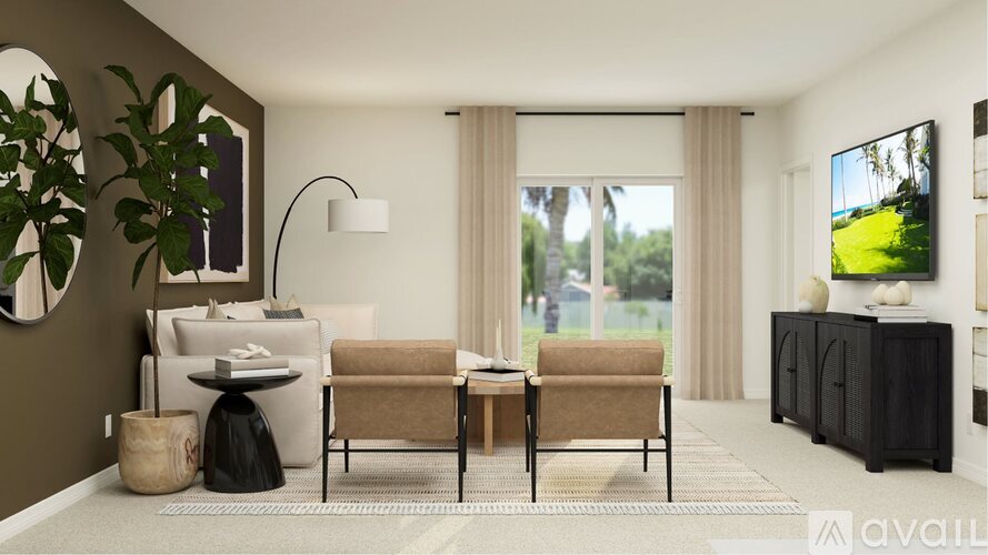 A living room with a sofa, chair, and a table with a lamp on it.