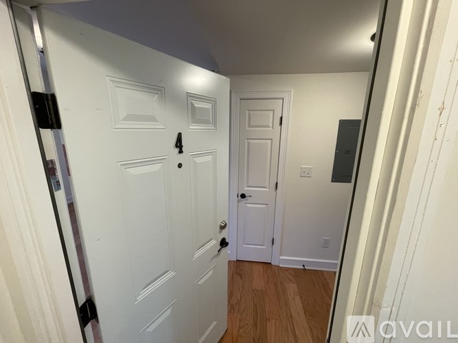 A hallway with a door numbered 4.