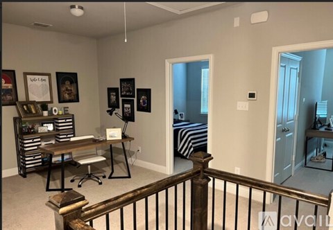A white toilet and sink in a bathroom.