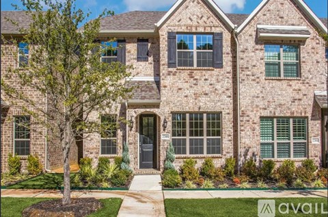 A house with a tree in front of it.