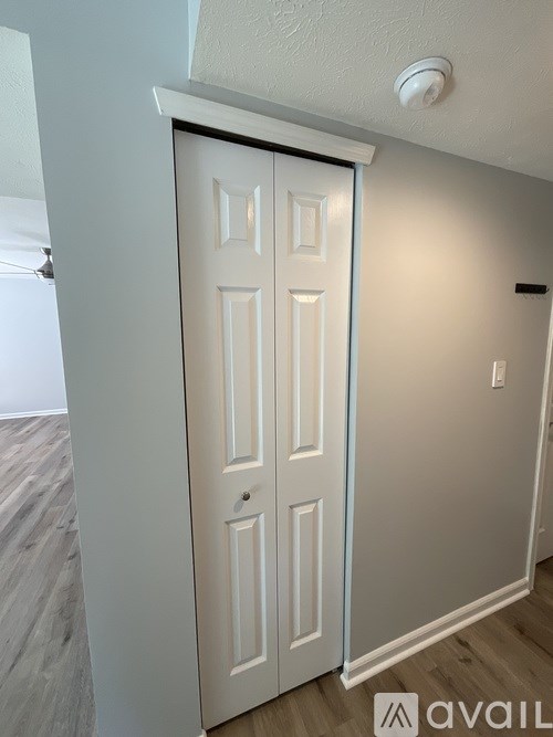 A white door with a black frame is closed.