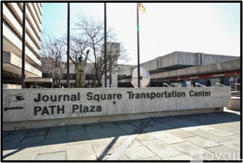 A sign that says Journal Square Transportation Center PATH Plaza.