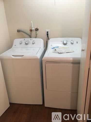 Two white sinks in a bathroom.
