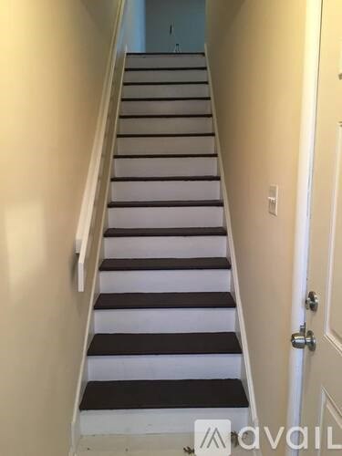 A staircase with alternating black and white steps.