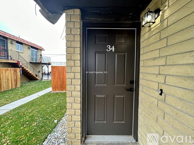 A black door with the number 34 on it.