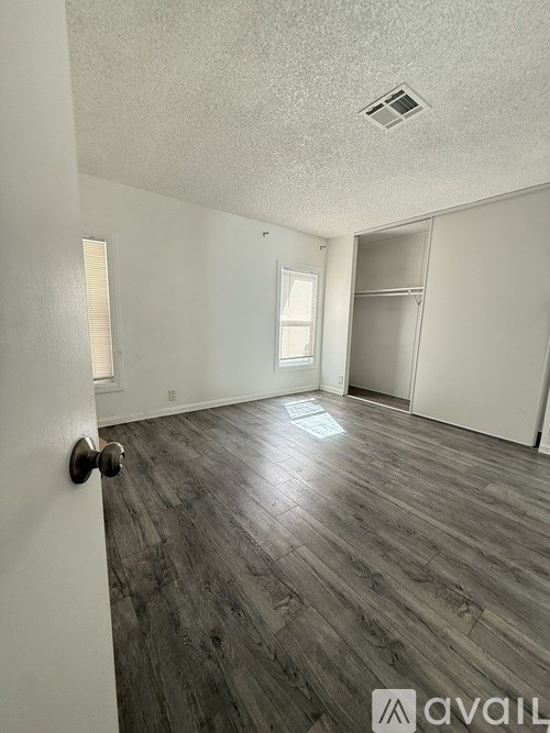 A room with a door and a window.