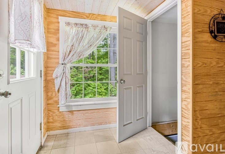 A room with a window and a door.