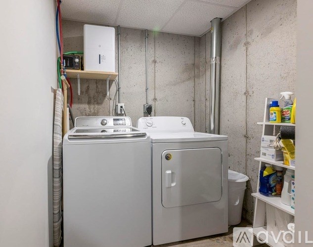 A laundry room with a washer and dryer.