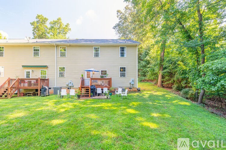 A house with a backyard and a deck.