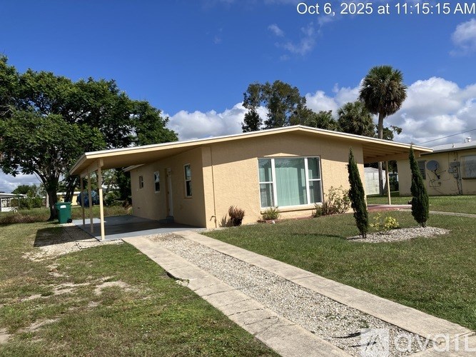 A house with a gravel pathway leading to the front door.