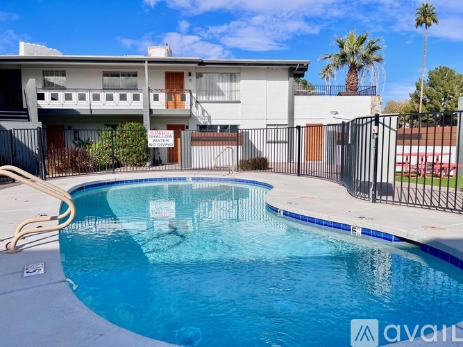 A pool in front of a house with a sign that says "available".