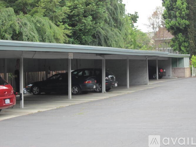 A parking garage with cars parked in it.
