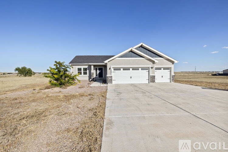 A house with a garage is available for sale.