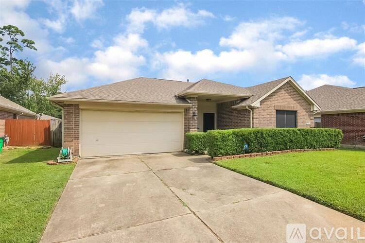 A house with a garage and a driveway is for sale.