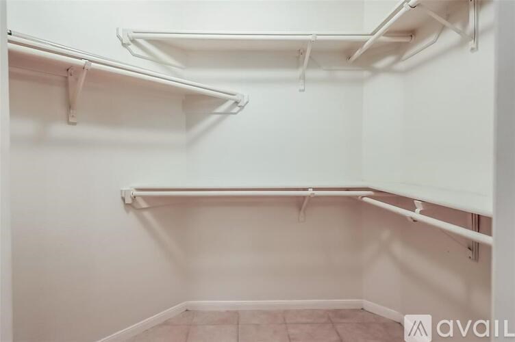 Empty white shelves in a room.